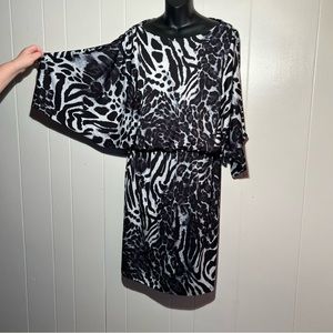 Women’s Animal Print dress with elastic waist and cool sleeves.